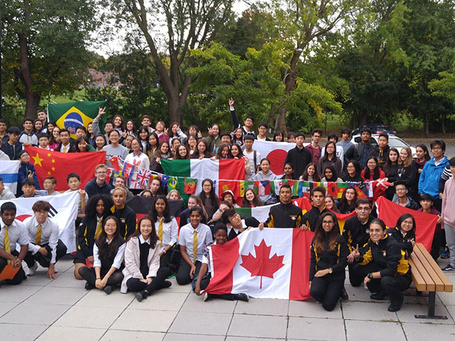 students with flags outdoors