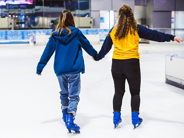 two girls skating