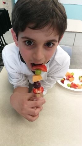 student eating fruit