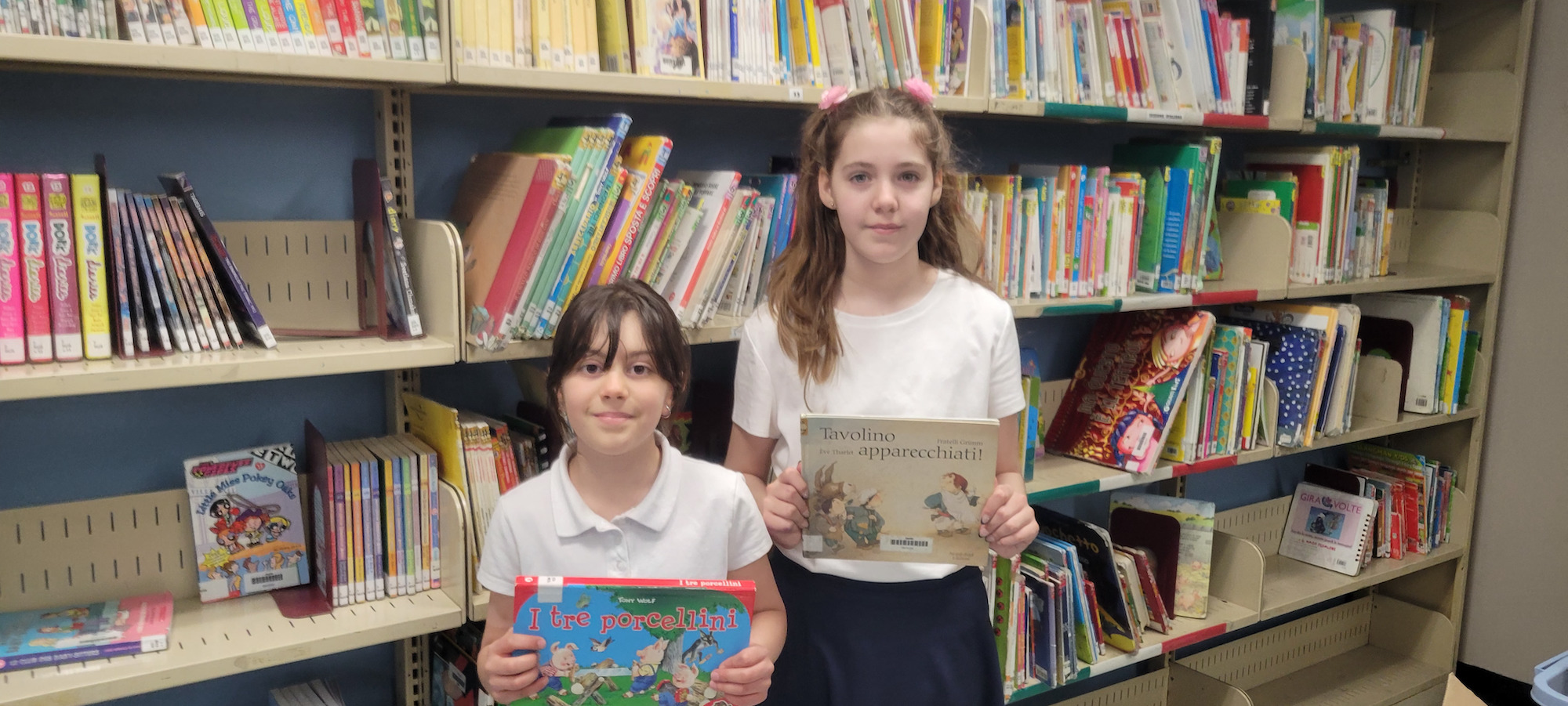 students holding italian books