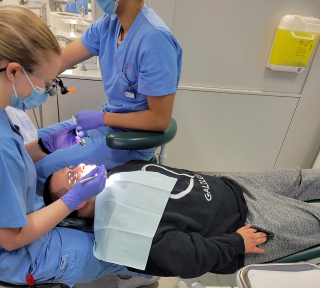 A high school student receives a dental check-up by McGill dental students on October 18. 