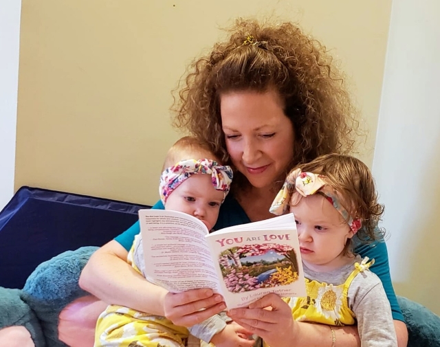 Lauren Tatner reading You Are Love to her daughters. Photo courtesy of Lauren Tatner