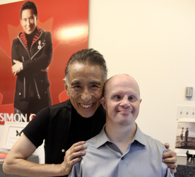 Simon Chang, left, welcomed Ariel Mechaly and his family to his studio on Chabanel St. for a ceremony of his Difference Maker award on September 18.  Photo: Wendy Singer 