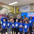 At St. Raphael Elementary School, from left, back row: Dr. Léna Moïse, school psychologist; Gail Callender, assistant director of Student Services; Jackie Alvarado and Cindy Mendez, both behaviour management specialists; Michelle Aubin, former educational consultant; Kathy Roach, community worker; Jasmin Skerritt, behaviour management specialist; and principal Joe Anne Désir. Front row: Grade 4 students.    Photo courtesy of St. Raphael Elementary School 