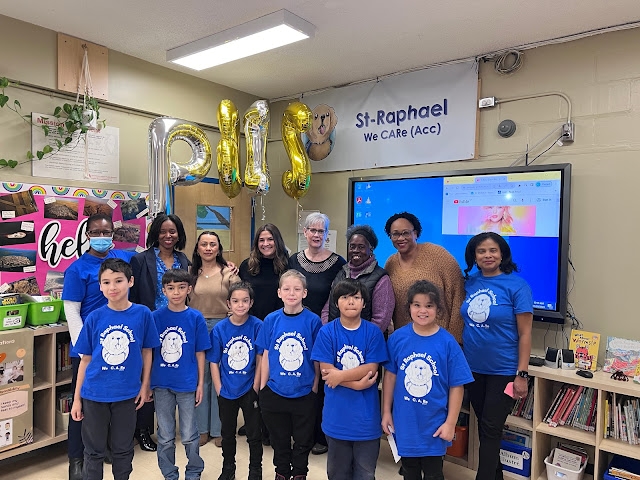 At St. Raphael Elementary School, from left, back row: Dr. Léna Moïse, school psychologist; Gail Callender, assistant director of Student Services; Jackie Alvarado and Cindy Mendez, both behaviour management specialists; Michelle Aubin, former educational consultant; Kathy Roach, community worker; Jasmin Skerritt, behaviour management specialist; and principal Joe Anne Désir. Front row: Grade 4 students.    Photo courtesy of St. Raphael Elementary School 