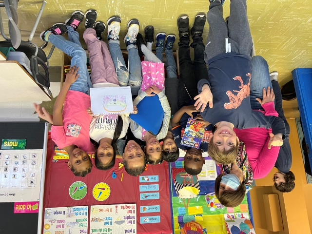 Students in Khalida Smahi’s class at John Caboto Elementary School consult with Simon Chang on their pencil case project on March 28. In front: William. Back, from left: Smahi, students Jaden, Mahid, Emma, Hannah and Layla surround Simon Chang, third from right. 