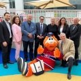 Habilitas Foundation, EMSB and CIUSS West-Central Montreal officials, as well as Youppi!, join together to cut the ribbon at the inauguration ceremony of the new and fully adapted playground at the Mackay Centre and Philip E. Layton schools.