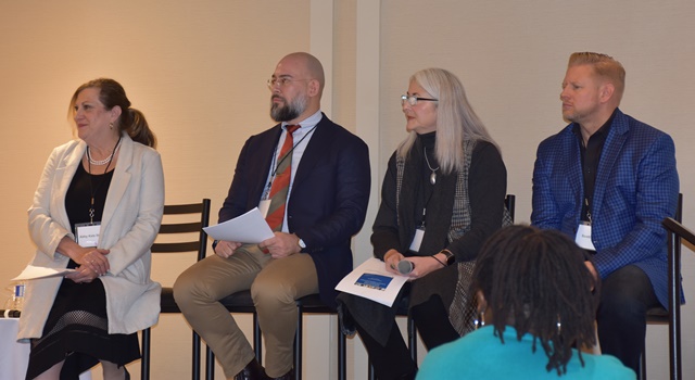 Group of four panelists sitting on stools on stage at RCDSO Access to Care Symposium on November 13, 2019.